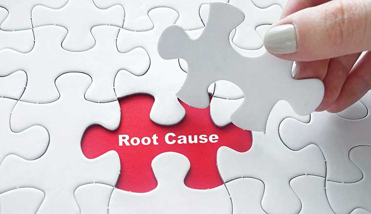 puzzle piece being lifted to reveal the words root cause