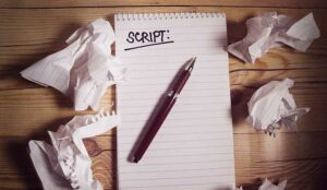 Script writer's notebook on a wooden table