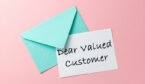 Green envelope and dear valued customer letter