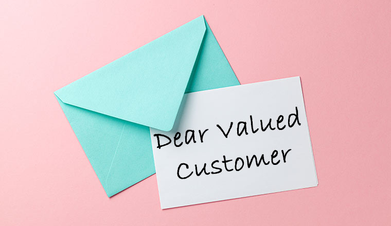 Green envelope and dear valued customer letter