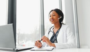 doctor in headset consulting with the patient over the phone