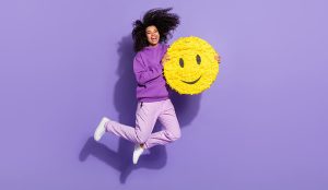 Happy person jumping with smiley face