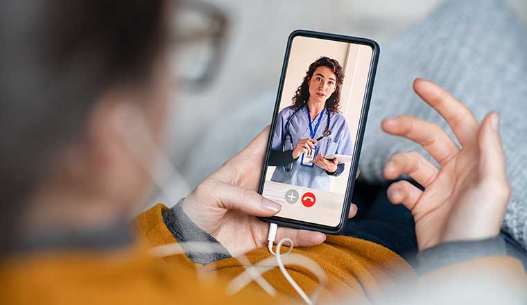 Person doing video call with doctor