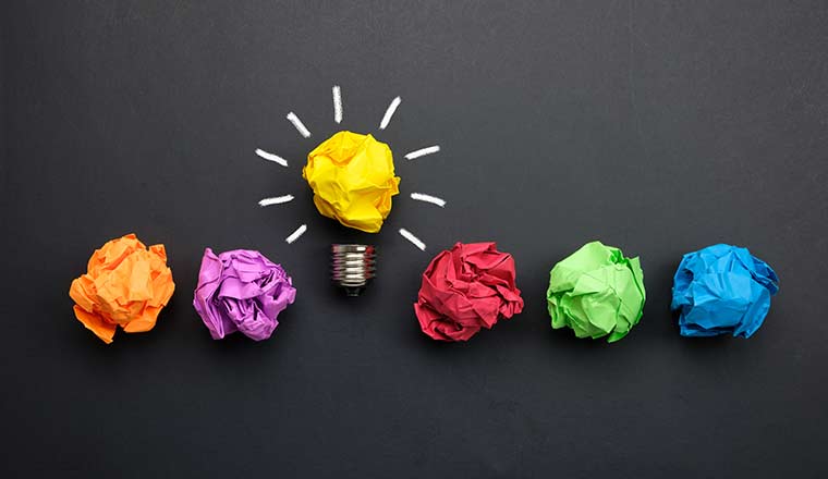 Great idea concept with crumpled colorful paper and light bulb