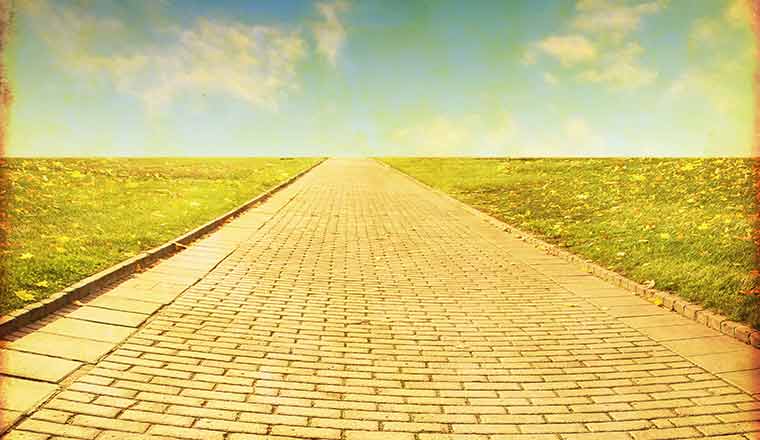 stone pathway leading to clouds