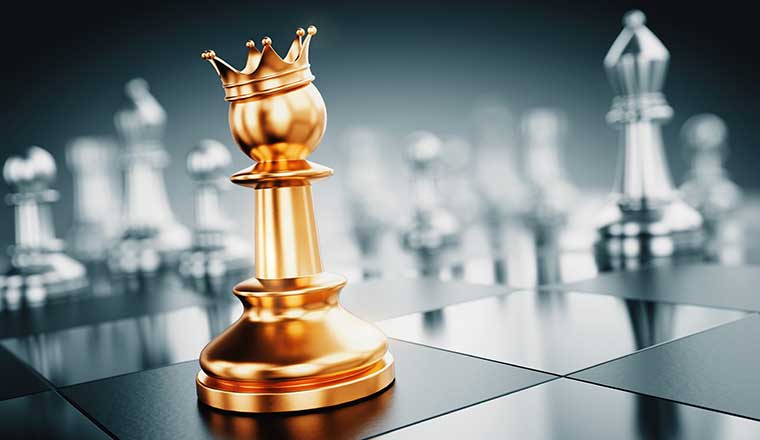 Winning and leadership concept with golden chess piece with crown