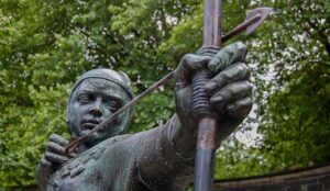 Detail of the statue of Robin Hood standing near Nottingham Castle in Nottingham, England.