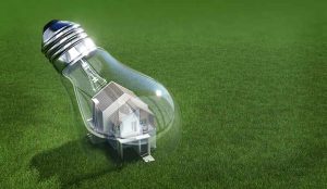 Utilities innovation concept with House In Light Bulb