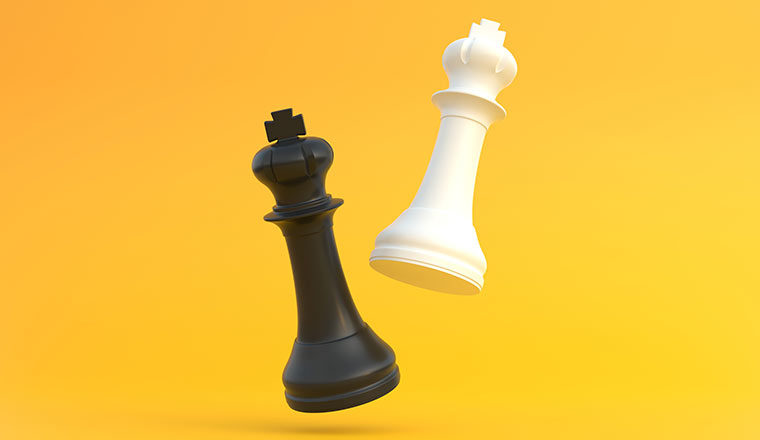Chess pieces on yellow background