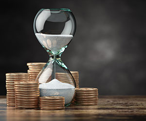 Golden coins and hourglass clock