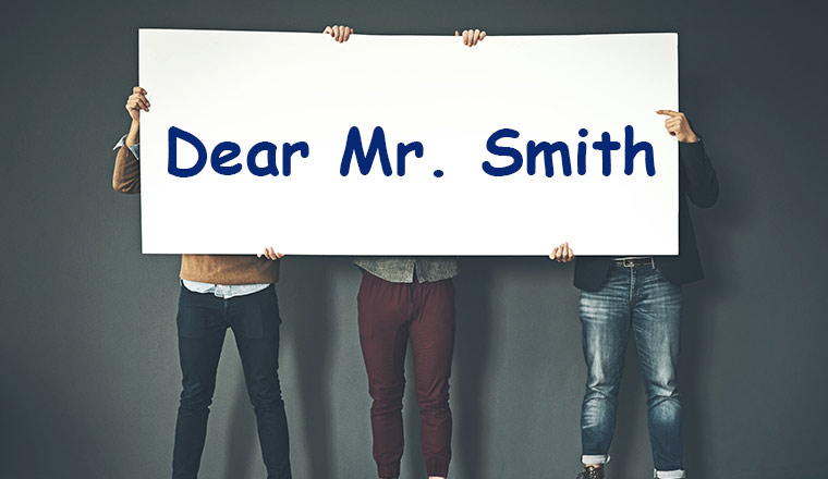 holding mr smith sign