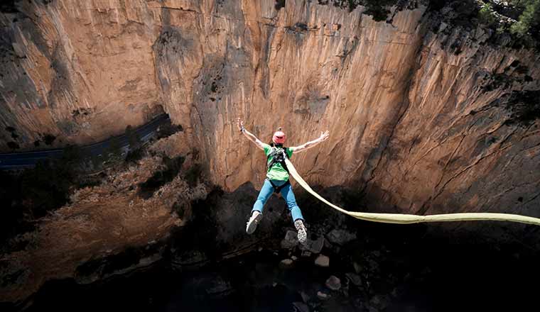 Safely lower concept with bungee jumper