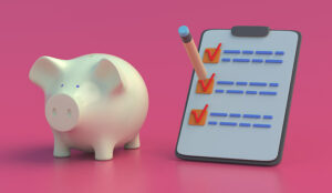 Checklist and piggy bank on pink background