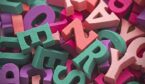 Pile of colorful painted wooden letters.