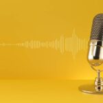 Gold microphone and sound wave on yellow background.