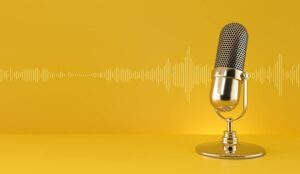 Gold microphone and sound wave on yellow background.