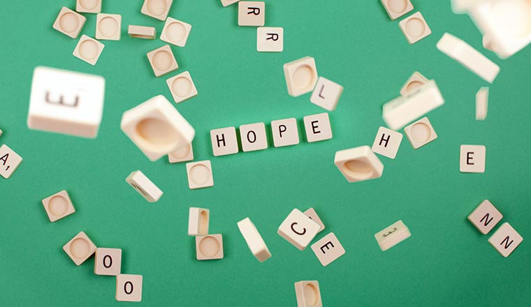 green background with scrabble pieces