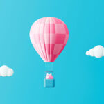 Piggy bank in hot air balloon on blue sky, with clouds