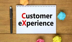 words CX customer experience on white note