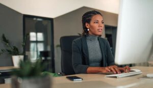 Manager working on computer in modern office