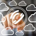 Person pushing phone icon surrounded by cloud icons