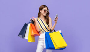 Person with shopping bags looking at phone