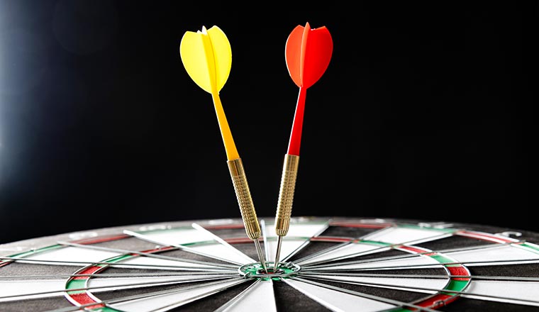 Two darts hitting on center target