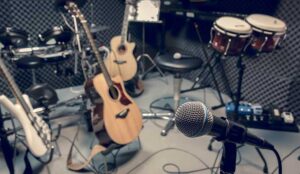 A microphone and musical equipment guitar ,bass, drum piano