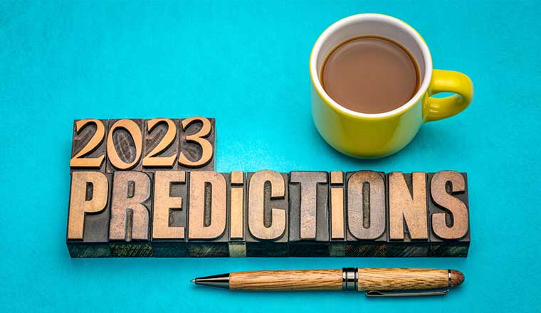 2023 year prediction concept - text in vintage letterpress wood type printing blocks with a cup of coffee