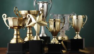 Group of the trophies on green background