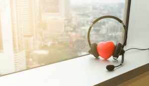 Headphones for call center with heart symbol put beside the office window