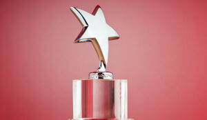 Star award against red gradient background