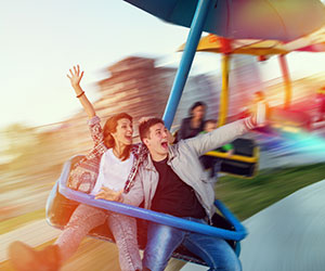 Two people having fun at amusement park