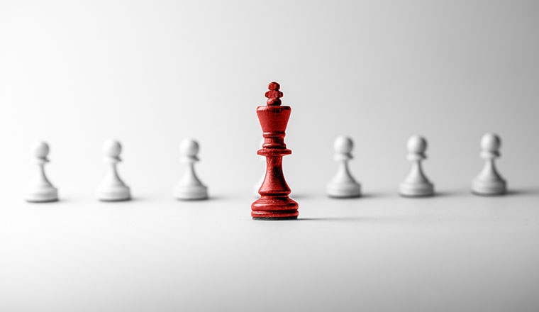Leadership concept with red chess piece