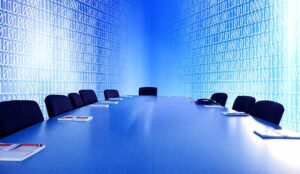 close up empty virtual meeting room with meeting table over binary codes