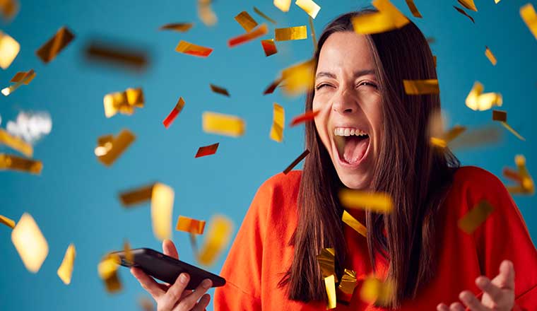 Celebrating Young Woman With Mobile Phone