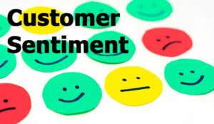Faces in different colours with the words customer sentiment
