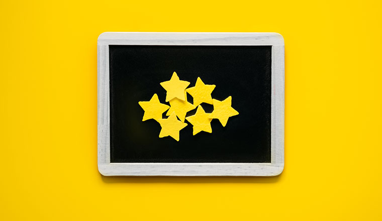 Customer Experience, Review Concept. Many yellow stars in frame on yellow background