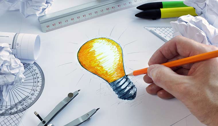 Innovation concept with hand drawing a lightbulb