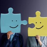 Portrait of two People with Happy Face Emotion on Jigsaw Puzzles - integrate concept