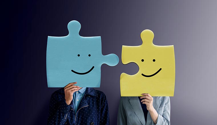 Portrait of two People with Happy Face Emotion on Jigsaw Puzzles - integrate concept