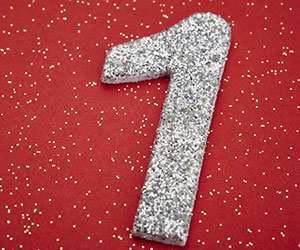 Number one silver color over a red background. 