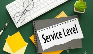 Service level written on torn paper on gray notebook