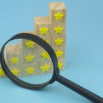 Cubes with yellow stars and magnifying glass