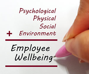 Words related to employee wellbeing being written on paper