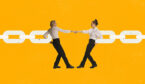 Two employees holding hands and connecting chain