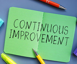 Continuous Improvement with sign on the page