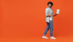 Person standing with laptop