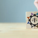 Business ethics concept. Ethical corporate culture with wooden cubes with ethics mindset and teamwork icons.