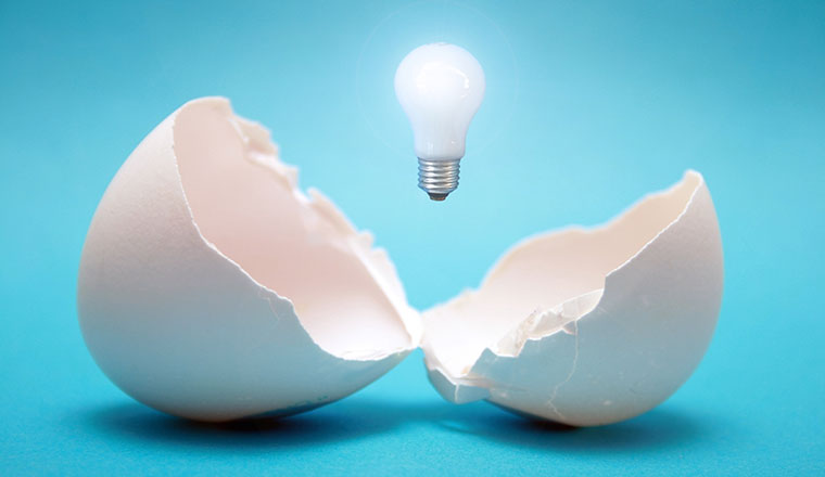 Idea concept with broken egg and lightbulb